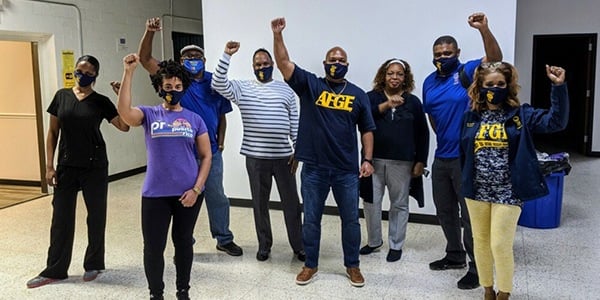 Group of AFGE members standing together wearing masks