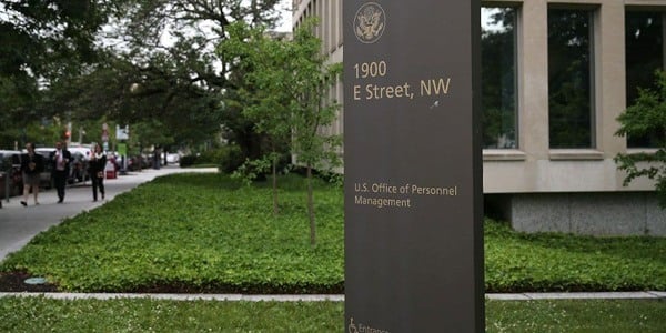 Image of sign with OPM and its address. 