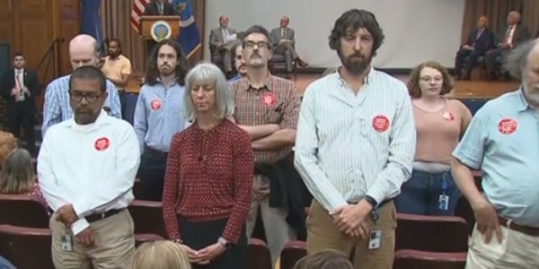 USDA workers standing up at a meeting