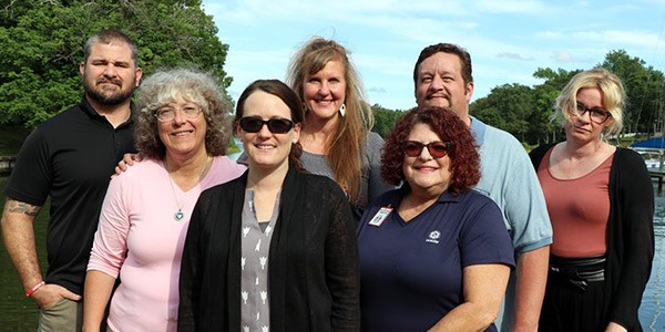 A group of seven members of the Machinists stand together. 