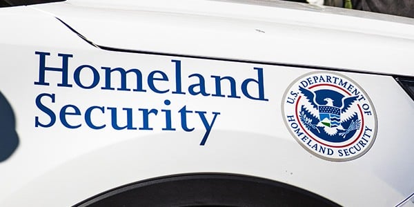 Homeland security written on side of SUV