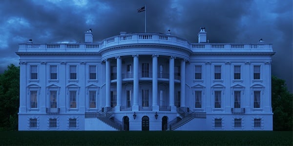 White house with dark blue and cloudy skies