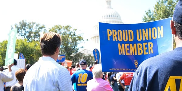 Rally sign that says proud union member outside of the US Capitol. 