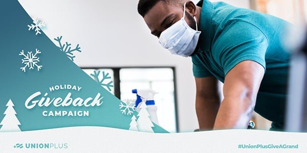 Black man cleaning a service wearing a mask with text that says Holiday Give Back Program