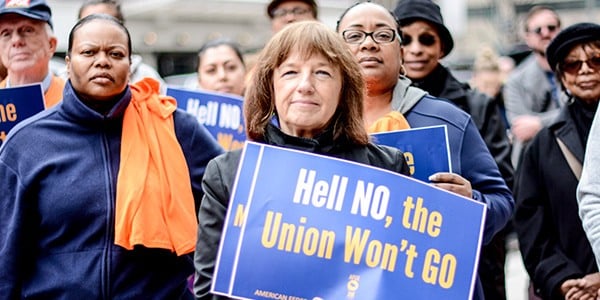 Rally goer holding sign that says Hell No, the Union Won't Go