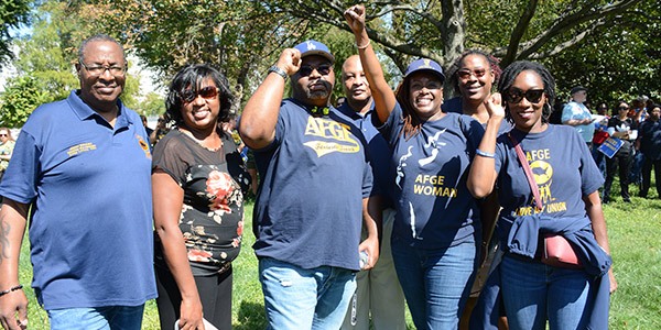 Rally goers smiling together outside of the US Capitol