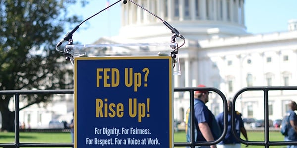 Event podium with Fed up, Rise up sign