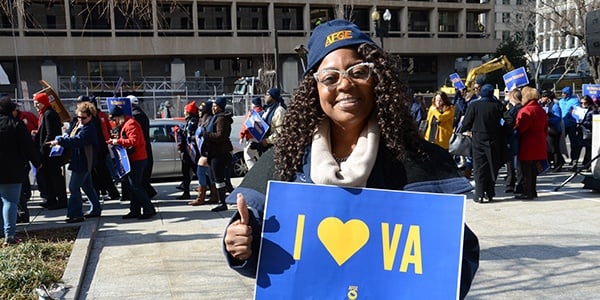 Rally goer holding sign that reads I heart VA