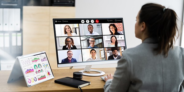 Person sitting at computer during a video conference call