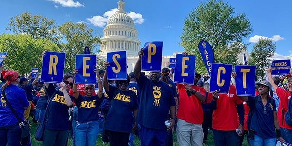 AFGE activists holding signs that spell RESPECT