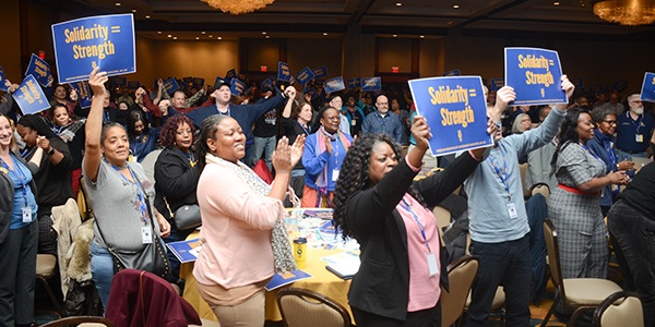 AFGE activists clapping and waiving signs at Legislative Conference