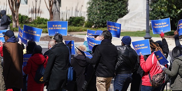 Rally goers marching with signs