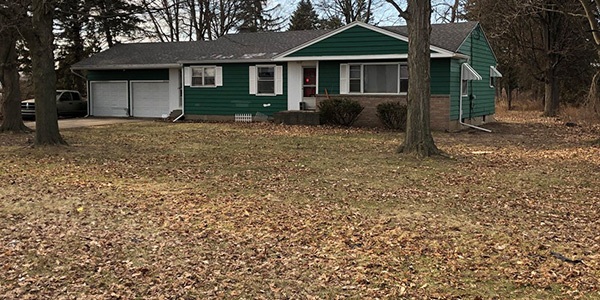 House with large front lawn