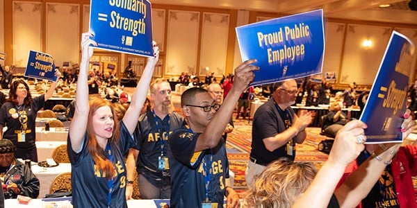 AFGE members holding signs