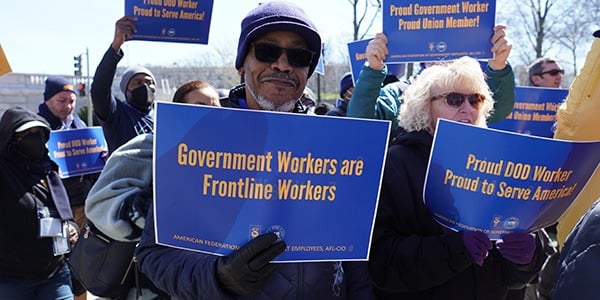 AFGE member with a rally sign