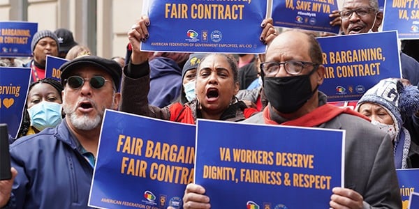 AFGE activist with a rally sign