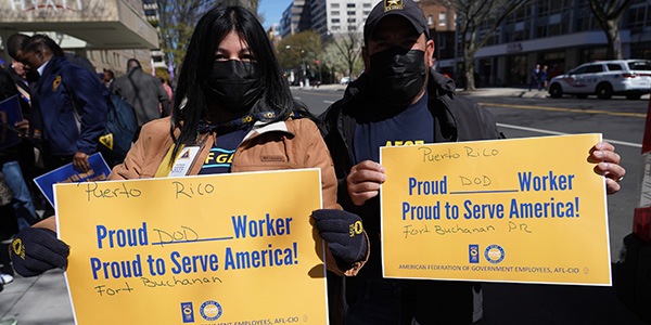 AFGE members holding rally signs