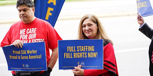 AFGE Members at SSA rally holding signs