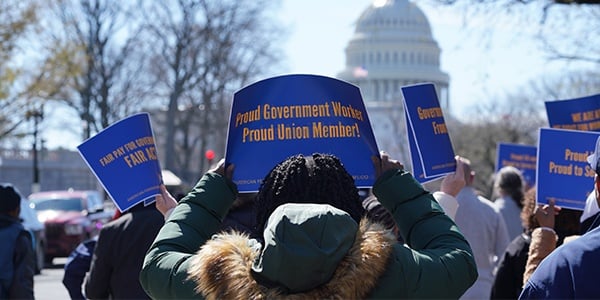 Activists with rally signs