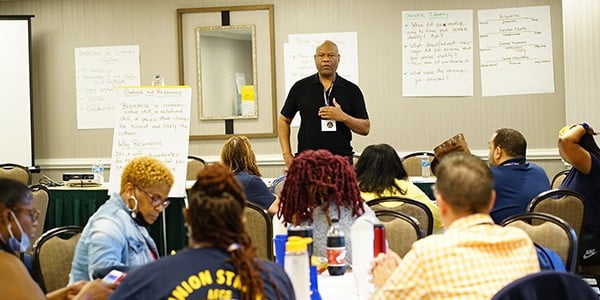 Conference attendees learning at a workshop