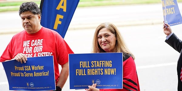 Members with signs at rally