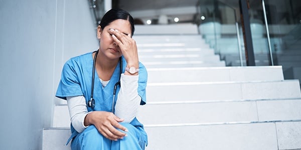 Nurse sitting on stairs