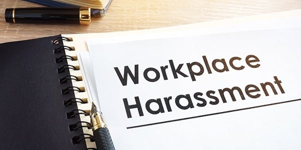 Notebook that says workplace harassment