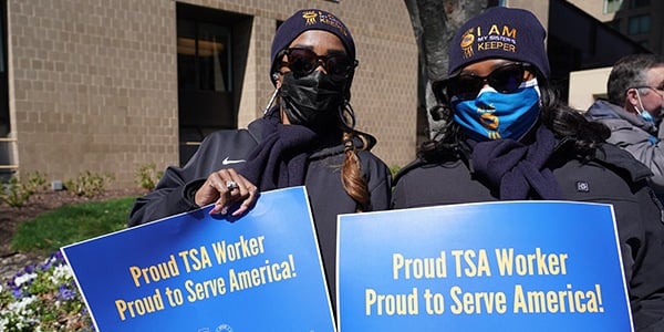 AFGE members holding rally signs