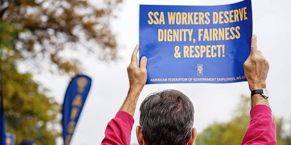 AFGE SSA activist holds rally sign