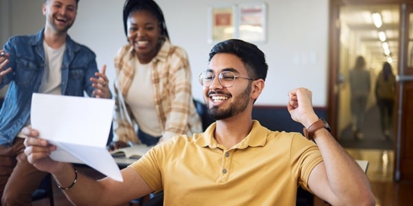 Stock photo of excited person reading a paper