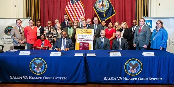 Group photo at VA contract signing