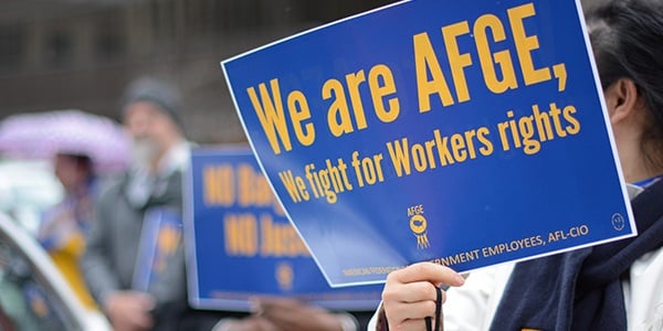 AFGE rally sign that says we are AFGE, We fight for workers' rights