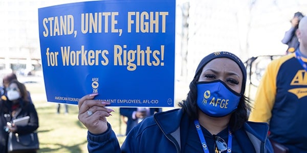 AFGE activist with rally sign