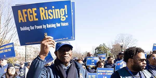 AFGE activist with rally sign