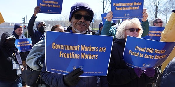 AFGE member holding rally sign