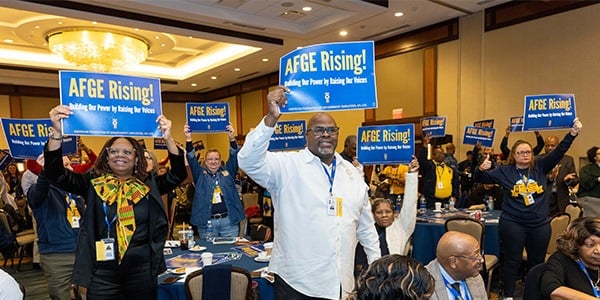 AFGE members holding rally signs