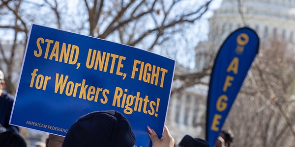 AFGE activist holding rally sign