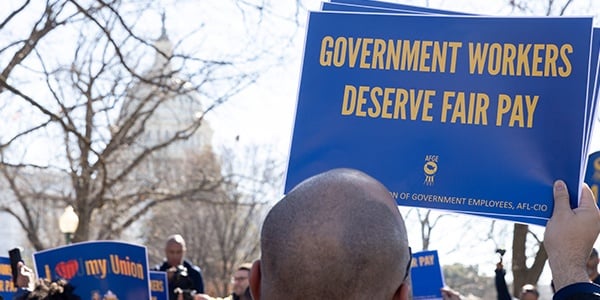 AFGE member holding rally sign