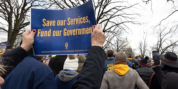 AFGE activists holding rally sign