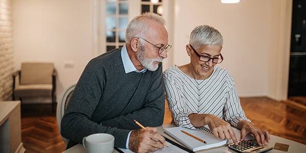 Older couple discussing finances. 