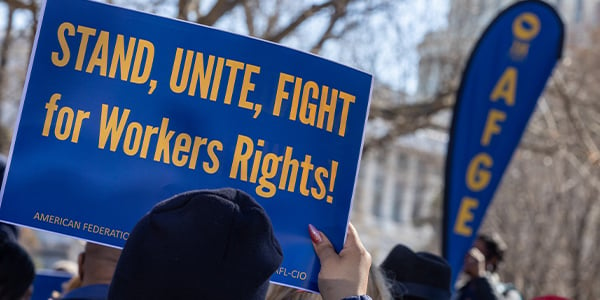 AFGE activist with rally sign