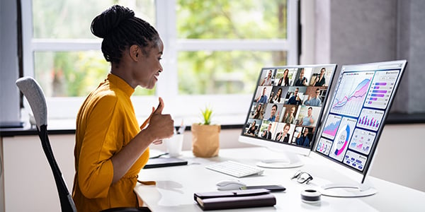 Workers sitting in front of a computer