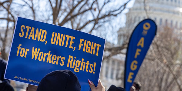 AFGE activist holding rally sign