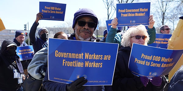 AFGE activist holding rally sign