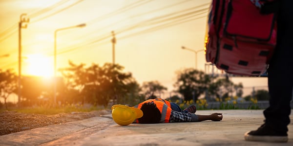 Stock photo of a construction worker laying on the ground