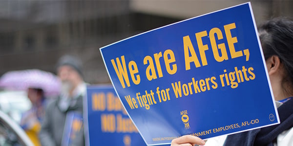 AFGE activist holding rally sign