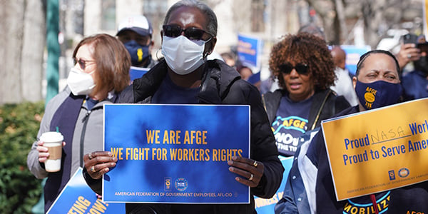 AFGE member holding rally sign