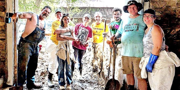 Community members cleaning up after Hurricane Helene