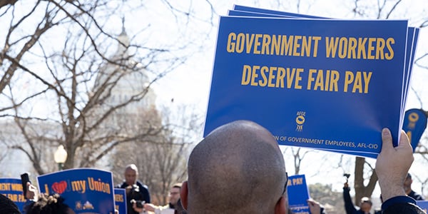 AFGE activist holding rally sign