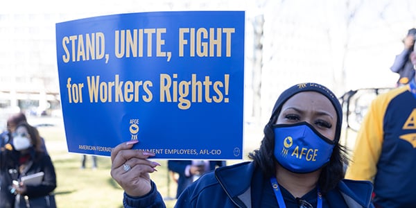 AFGE activist holding rally sign